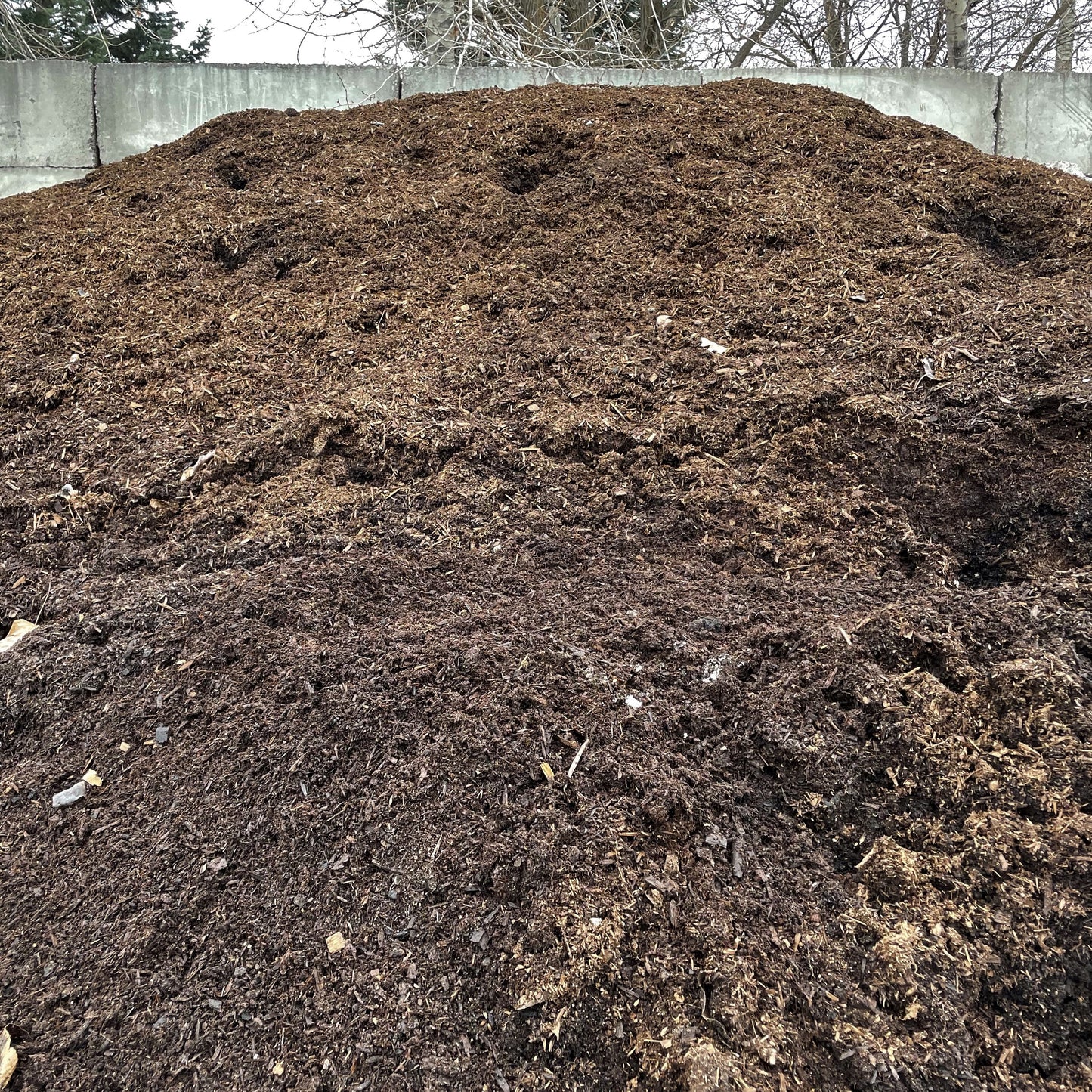 A large pile of organic poultry compost from Missoula Dirt Delivery. 
