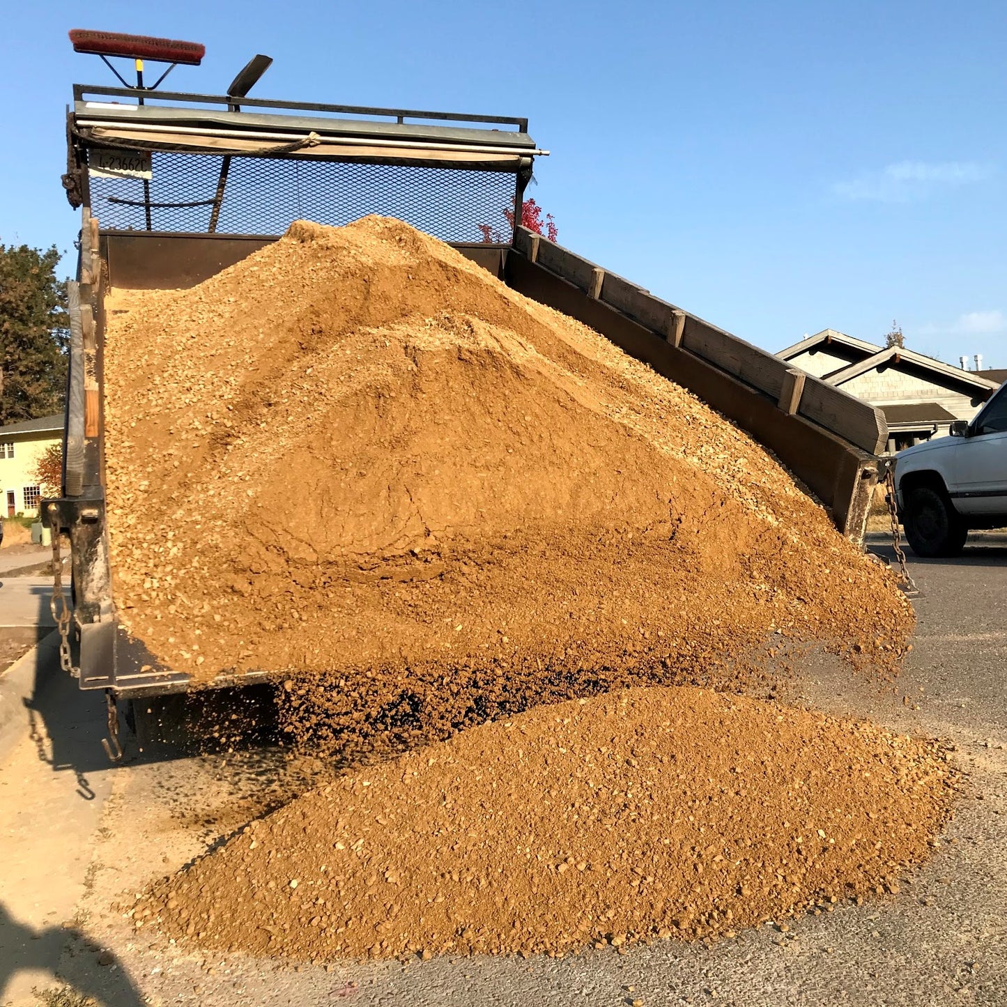 A big dump of road base gravel from Missoula Dirt Delivery's dump truck.