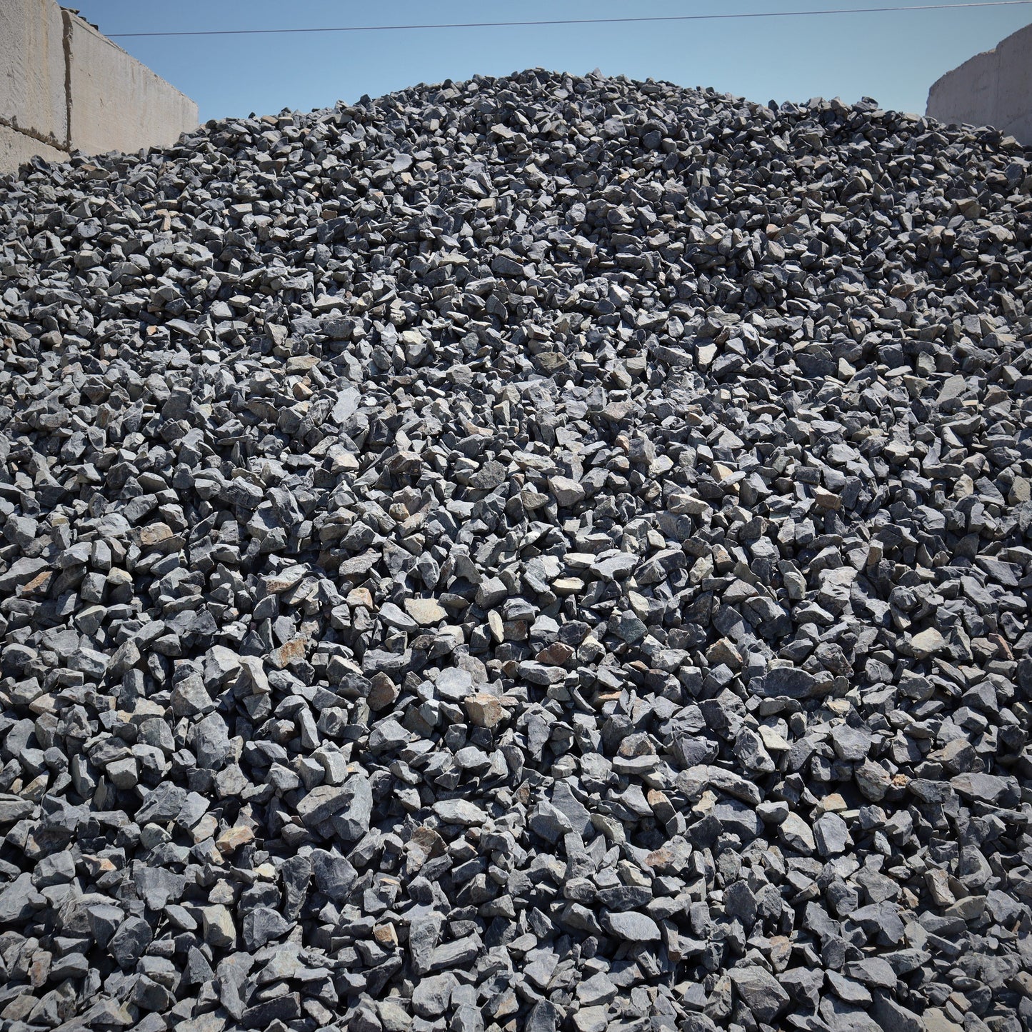 Side view of 2 inch fractured black rock gravel from Missoula Dirt Delivery.