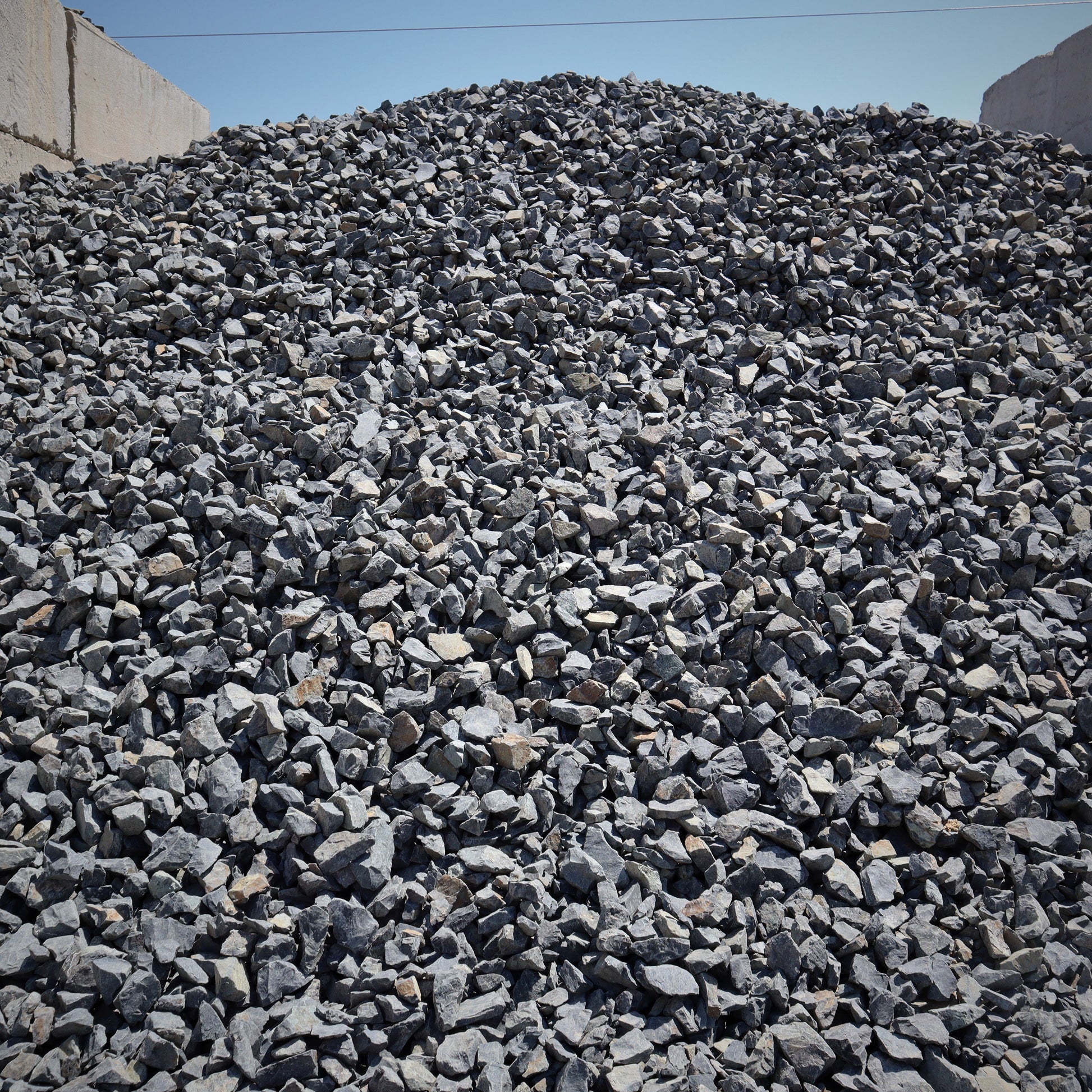 Side view of 2 inch fractured black rock gravel from Missoula Dirt Delivery.
